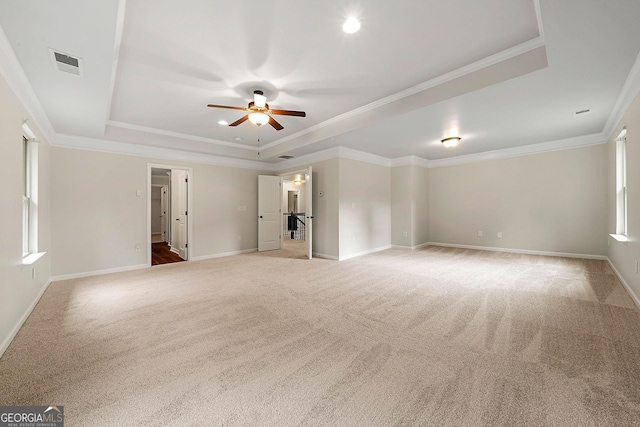 3865 Rifflepool Ct, Douglasville, GA 30135 - spare room featuring a raised ceiling, carpet flooring, a ceiling fan, and ornamental molding