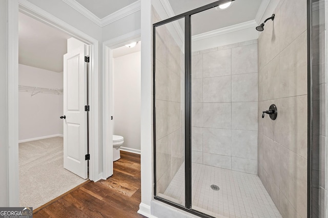 3865 Rifflepool Ct, Douglasville, GA 30135 - full bath with a shower stall, a spacious closet, ornamental molding, and wood finished floors