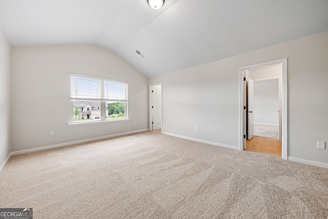 3865 Rifflepool Ct, Douglasville, GA 30135 - unfurnished bedroom featuring light colored carpet and lofted ceiling