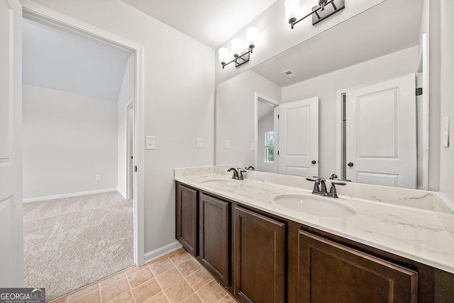 3865 Rifflepool Ct, Douglasville, GA 30135 - bathroom with double vanity and baseboards
