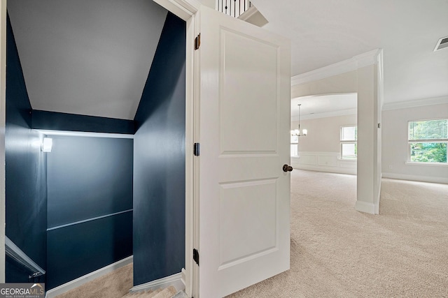 3865 Rifflepool Ct, Douglasville, GA 30135 - hall featuring crown molding, carpet, and a chandelier