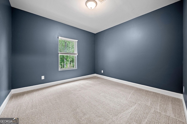 3865 Rifflepool Ct, Douglasville, GA 30135 - carpeted empty room with baseboards
