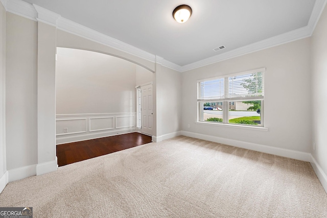 3865 Rifflepool Ct, Douglasville, GA 30135 - carpeted empty room with ornamental molding and arched walkways