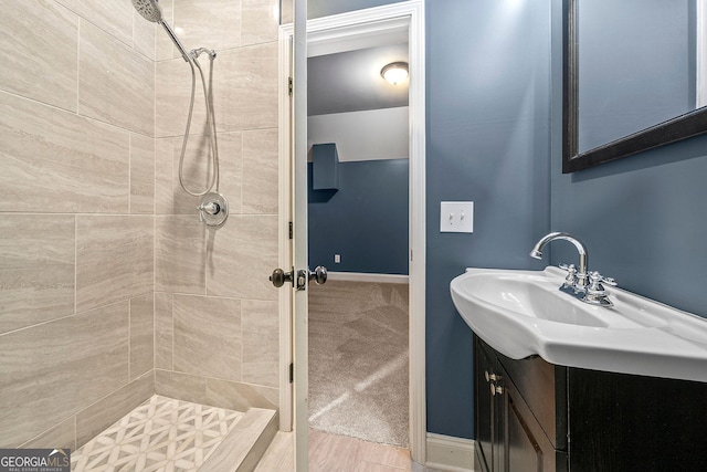 3865 Rifflepool Ct, Douglasville, GA 30135 - bathroom featuring a tile shower and vanity