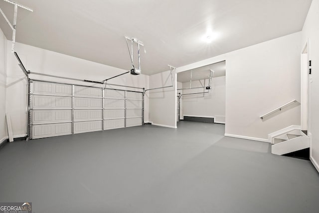 3865 Rifflepool Ct, Douglasville, GA 30135 - garage featuring baseboards and a garage door opener