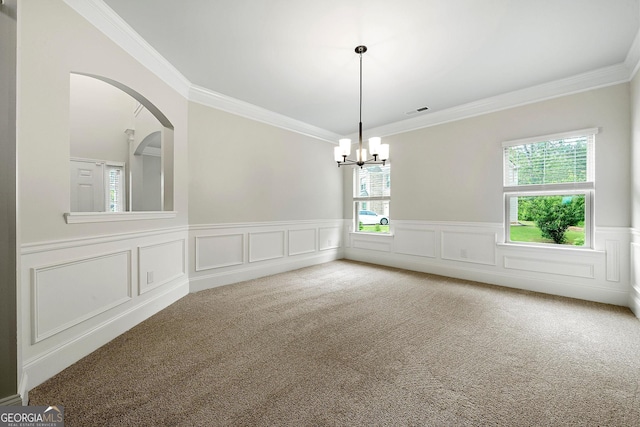 3865 Rifflepool Ct, Douglasville, GA 30135 - carpeted spare room with a chandelier, crown molding, a wainscoted wall, a decorative wall, and arched walkways