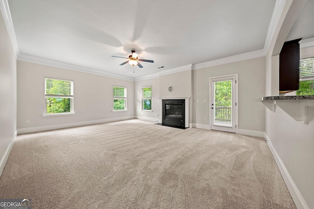 3865 Rifflepool Ct, Douglasville, GA 30135 - unfurnished living room with carpet flooring, crown molding, a ceiling fan, and a fireplace with flush hearth