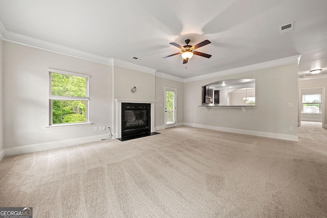 3865 Rifflepool Ct, Douglasville, GA 30135 - unfurnished living room featuring ornamental molding, light carpet, ceiling fan, and a fireplace with flush hearth