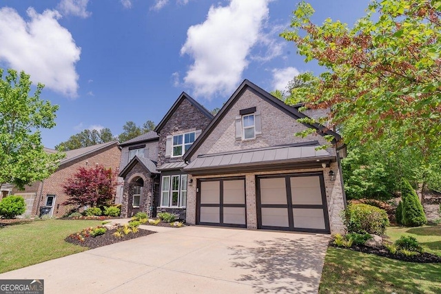 2720 Garonne Way, Cumming, GA 30041 - craftsman inspired home featuring driveway, a standing seam roof, a front yard, and stone siding