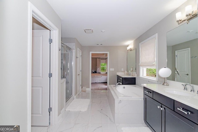 2720 Garonne Way, Cumming, GA 30041 - bathroom featuring marble finish flooring, a stall shower, vanity, and plenty of natural light
