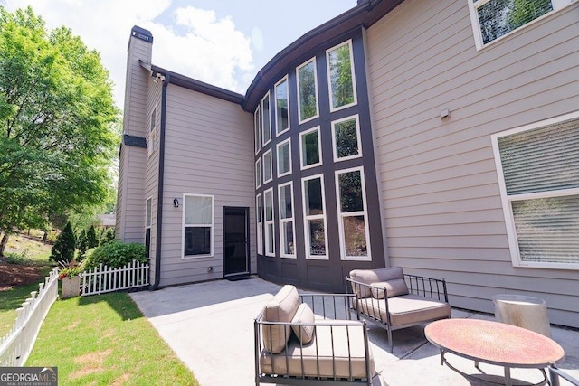 2720 Garonne Way, Cumming, GA 30041 - back of property with a patio area, a chimney, and an outdoor living space