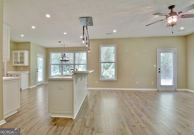 1709 Reese Rd, Sharpsburg, GA 30277 - kitchen featuring light wood-style floors, white cabinets, light countertops, recessed lighting, and a ceiling fan