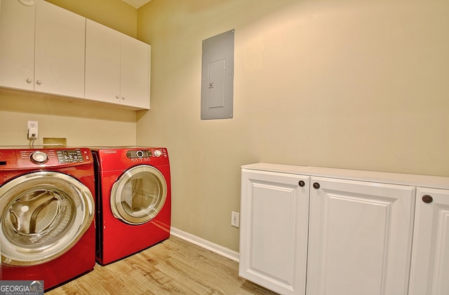 1709 Reese Rd, Sharpsburg, GA 30277 - laundry room featuring cabinet space, electric panel, washing machine and dryer, and light wood finished floors