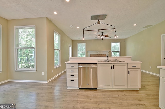 1709 Reese Rd, Sharpsburg, GA 30277 - kitchen featuring dishwasher, a textured ceiling, light wood finished floors, recessed lighting, and light countertops