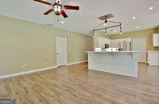 1709 Reese Rd, Sharpsburg, GA 30277 - unfurnished living room with recessed lighting, light wood finished floors, and ceiling fan