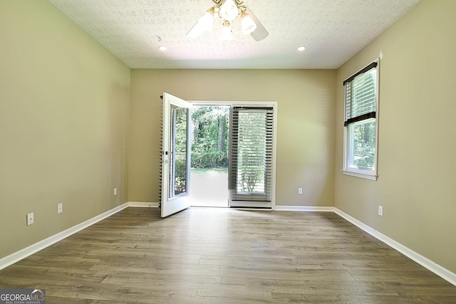 1709 Reese Rd, Sharpsburg, GA 30277 - empty room with ceiling fan, wood finished floors, and a textured ceiling