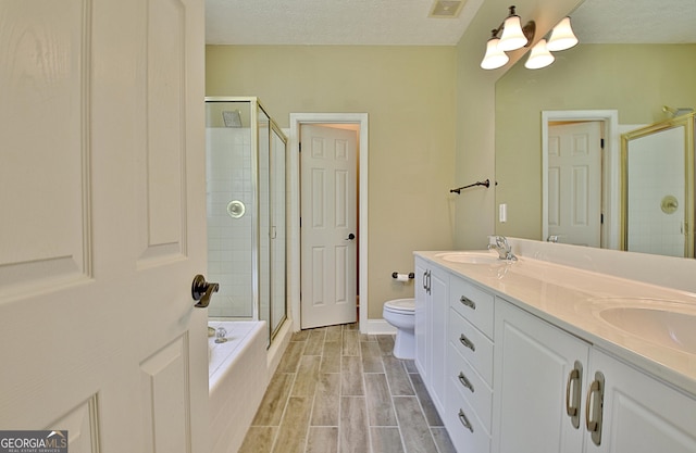1709 Reese Rd, Sharpsburg, GA 30277 - bathroom featuring a tile shower, double vanity, a tub, a chandelier, and a textured ceiling