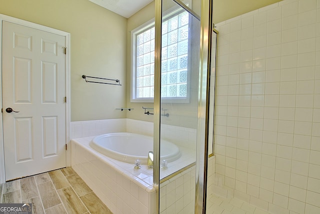 1709 Reese Rd, Sharpsburg, GA 30277 - bathroom with a garden tub and a stall shower