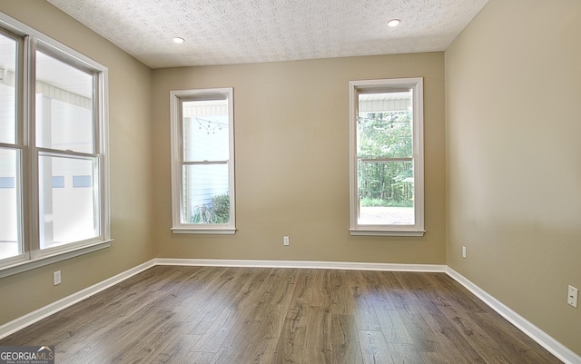 1709 Reese Rd, Sharpsburg, GA 30277 - spare room featuring dark wood finished floors and baseboards