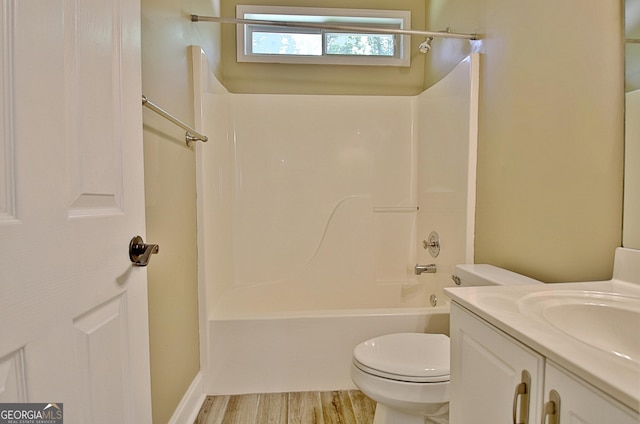 1709 Reese Rd, Sharpsburg, GA 30277 - full bathroom featuring vanity, shower / bathtub combination, and wood finished floors