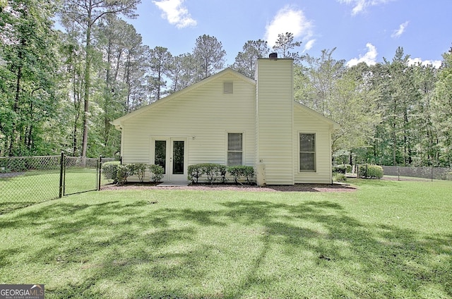 1709 Reese Rd, Sharpsburg, GA 30277 - rear view of property with a gate, a chimney, and french doors