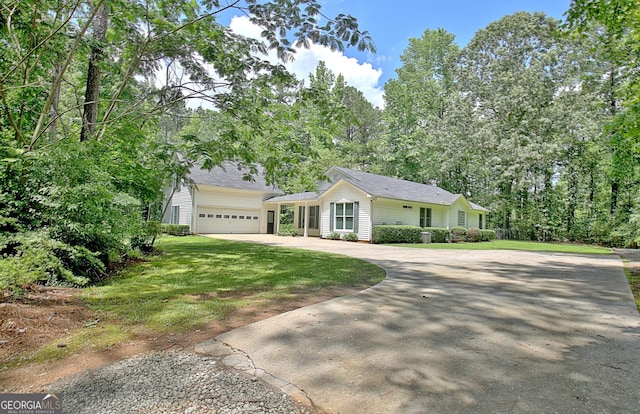 1709 Reese Rd, Sharpsburg, GA 30277 - view of front facade with concrete driveway, a front yard, roof with shingles, and a garage