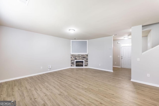 243 Flowing Meadows Dr, Kathleen, GA 31047 - unfurnished living room featuring wood finished floors and a fireplace