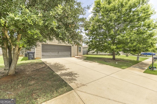 243 Flowing Meadows Dr, Kathleen, GA 31047 - view of property hidden behind natural elements featuring a front lawn and driveway
