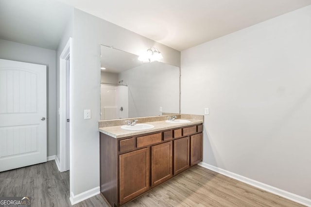 243 Flowing Meadows Dr, Kathleen, GA 31047 - full bath featuring wood finished floors and double vanity