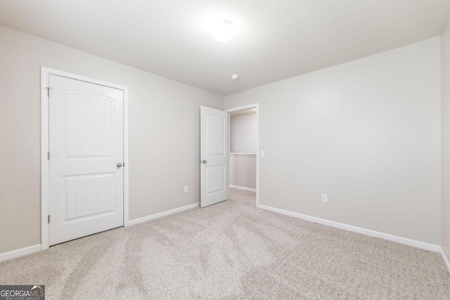 243 Flowing Meadows Dr, Kathleen, GA 31047 - unfurnished bedroom with carpet floors and baseboards