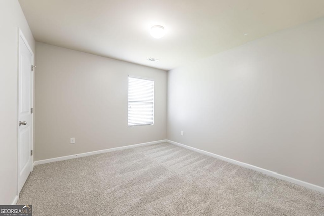 243 Flowing Meadows Dr, Kathleen, GA 31047 - spare room featuring light colored carpet and baseboards