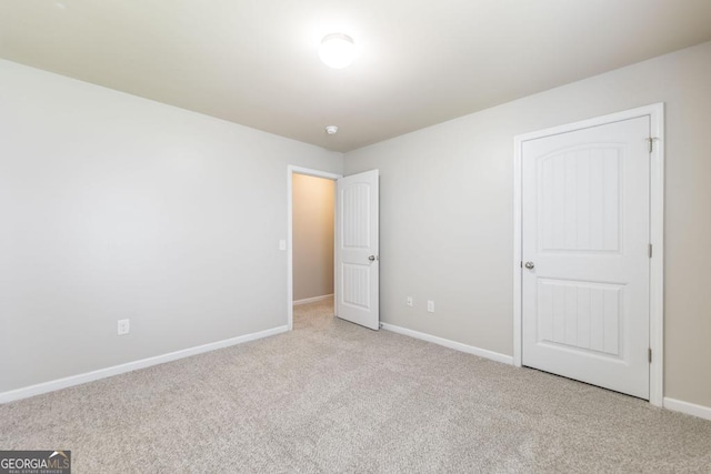 243 Flowing Meadows Dr, Kathleen, GA 31047 - unfurnished bedroom featuring carpet flooring and baseboards