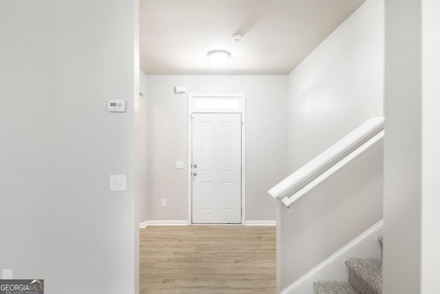 243 Flowing Meadows Dr, Kathleen, GA 31047 - entryway featuring light wood-style floors and stairs