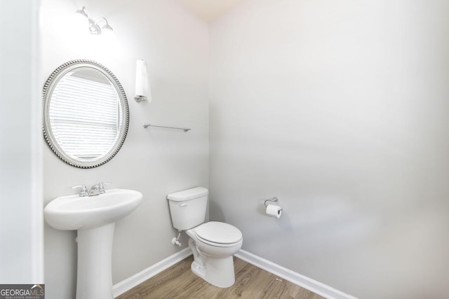 243 Flowing Meadows Dr, Kathleen, GA 31047 - bathroom featuring toilet and wood finished floors