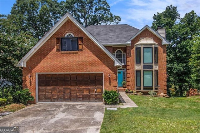 1452 Crooked Tree Cir, Stone Mountain, GA 30088 - view of front facade featuring an attached garage, brick siding, driveway, a chimney, and a front yard