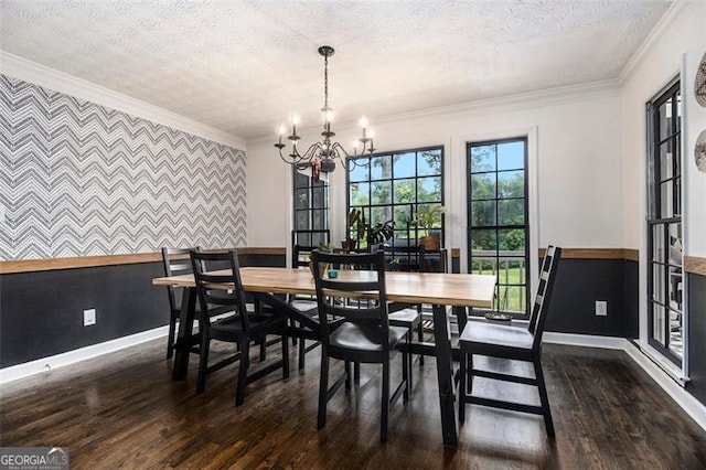 1452 Crooked Tree Cir, Stone Mountain, GA 30088 - dining space featuring an accent wall, a textured ceiling, a chandelier, dark wood finished floors, and crown molding