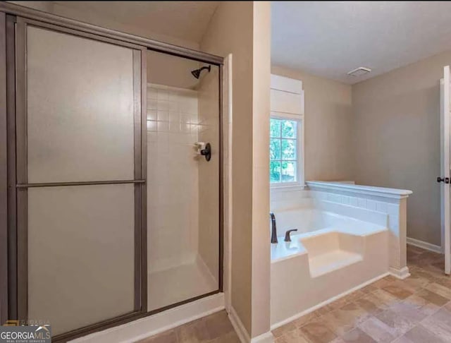 1875 Tree Brooke Ln, Snellville, GA 30078 - bathroom with a shower stall and a bath