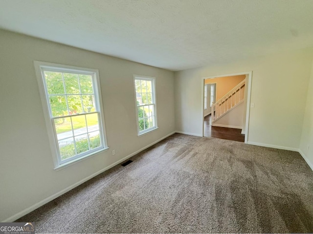 1875 Tree Brooke Ln, Snellville, GA 30078 - spare room featuring stairway and carpet flooring