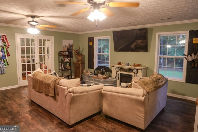 1665 Jackson Lake Rd, Mansfield, GA 30055 - living room with ceiling fan, dark wood finished floors, a textured ceiling, a fireplace, and french doors