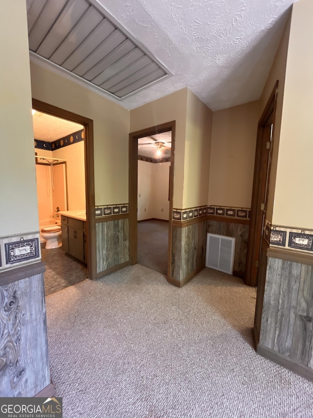 172 Fred Henry Ln, Clayton, GA 30525 - carpeted empty room featuring a wainscoted wall and a textured ceiling