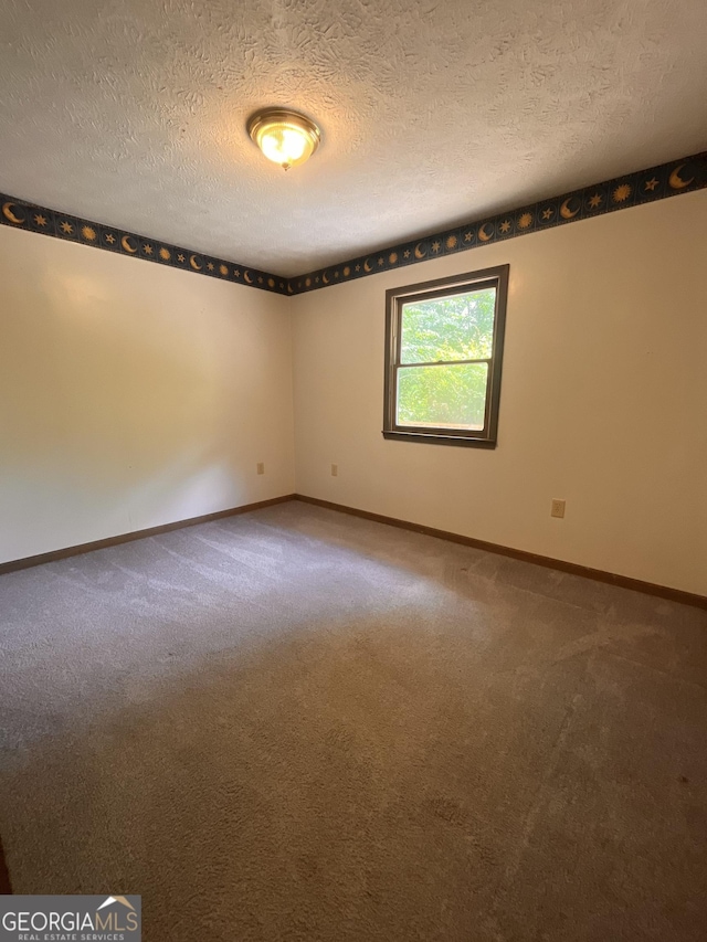 172 Fred Henry Ln, Clayton, GA 30525 - carpeted empty room featuring a textured ceiling and baseboards