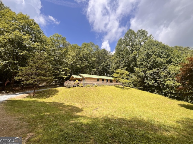 172 Fred Henry Ln, Clayton, GA 30525 - view of front facade featuring a front lawn and a wooded view