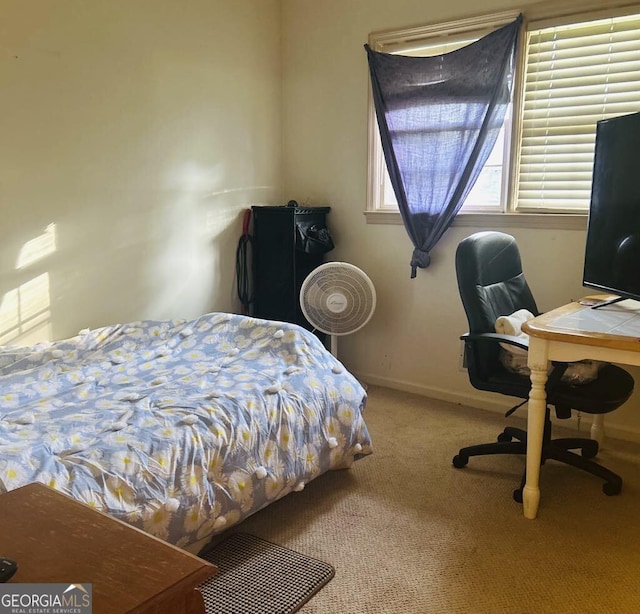 2235 Lyn Ct, Macon, GA 31206 - carpeted bedroom featuring an office area and baseboards