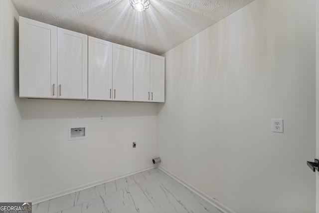 5437 Chatham Woods Ct, Columbus, GA 31907 - washroom with cabinet space, washer hookup, marble look tile flooring, and hookup for an electric dryer