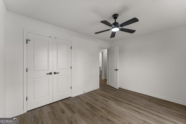 5437 Chatham Woods Ct, Columbus, GA 31907 - unfurnished bedroom with wood finished floors, a closet, and ceiling fan