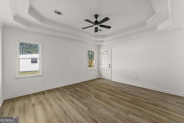 5437 Chatham Woods Ct, Columbus, GA 31907 - empty room with a raised ceiling, ornamental molding, healthy amount of natural light, ceiling fan, and wood finished floors