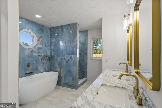 5437 Chatham Woods Ct, Columbus, GA 31907 - full bathroom with a freestanding bath, walk in shower, double vanity, a textured ceiling, and marble finish flooring