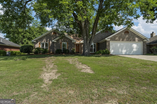 5437 Chatham Woods Ct, Columbus, GA 31907 - view of front facade featuring driveway, an attached garage, a front lawn, and brick siding