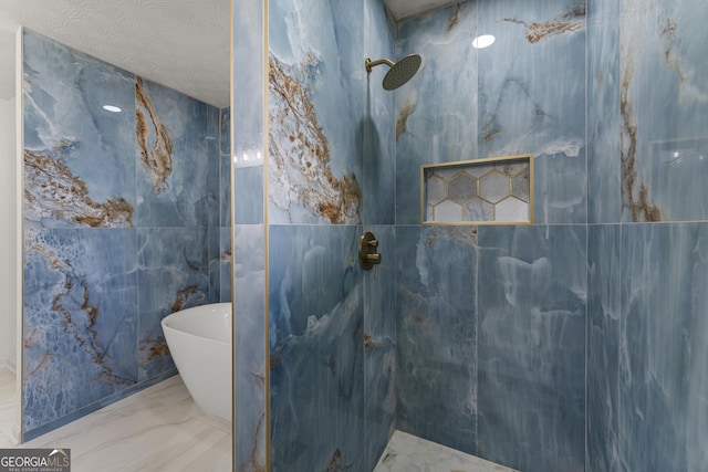 5437 Chatham Woods Ct, Columbus, GA 31907 - full bath featuring a marble finish shower, a freestanding bath, marble finish flooring, and tile walls