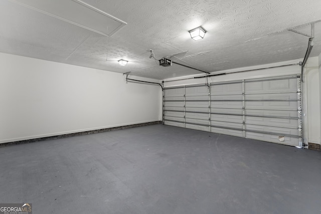 5437 Chatham Woods Ct, Columbus, GA 31907 - garage with a garage door opener and baseboards